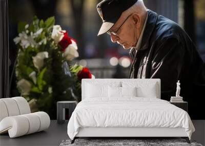 A nostalgic moment as a veteran places a wreath beside a United States flag-draped memorial Wall mural