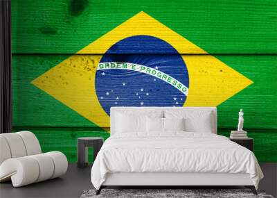 Brazil flag painted on old wood plank background. Brushed natural light knotted wooden board texture. Wooden texture background flag of Brazil. Wall mural