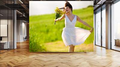 adorable happy summer woman skipping Wall mural