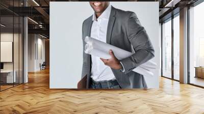 Confident portrait of black architect engineer  holding plans is Wall mural