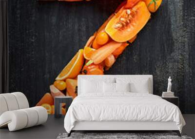 Overhead of orange raw organic produce alphabet letter for desig Wall mural