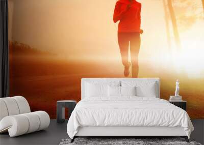 Sunrise running woman Wall mural