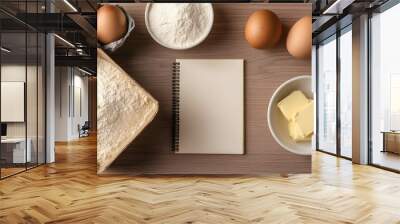 Ingredients for baking include flour, eggs, butter, and a blank notepad for notes or recipes, perfect for culinary inspiration. Wall mural