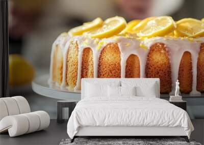 A delicious lemon cake topped with slices and glaze, perfect for dessert. Wall mural