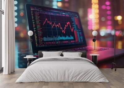 A laptop displaying a stock market graph with vibrant city lights in the background. Wall mural