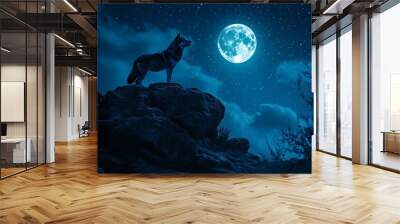 A wolf stands on a rock under a bright moonlit sky filled with stars. Wall mural