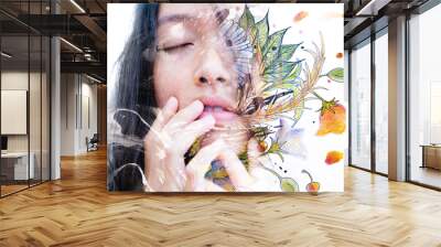 Paintography. Double exposure close-up of a sensual peaceful asian model gently touching her face combined with hand drawn ink and watercolour paintings with floral motifs Wall mural