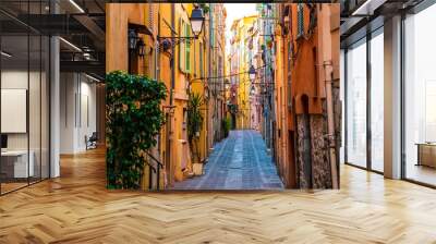 Narrow & colorful street of Menton, France. Wall mural