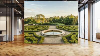 Small lovely public garden at the foot of 17th century Chateau d’Auvers sur Oise at sunset. Auvers-sur-Oise (27.2 km from Paris), France. Wall mural