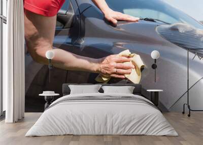 brunette woman washes her car Wall mural