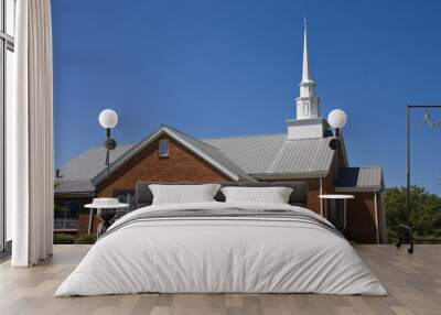 an old small brick baptist church and blue sky Wall mural