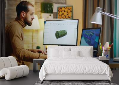 Bearded engineer sitting at his desk in home office Wall mural