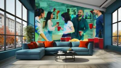 Chips and cups with beer on the table Wall mural