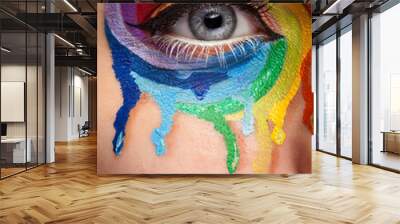 Close up eye with cry colors in a wheel arround the eye. Art stage conceptul make up Wall mural