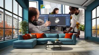 Diverse team of engineer architects working on modern cad program developing construction metalic components. Industrial designer studying prototype idea on pc showing digital software with gears Wall mural