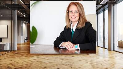 Middle aged business woman in her office. Smart woman . Wall mural