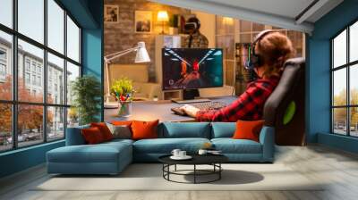 Professional video gamer female playing an online shooter game Wall mural