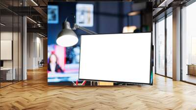 Remote worker looking at white template on pc monitor, sitting at home and using empty computer layout screen. African american freelancer checks isolated blank display at his workstation. Wall mural