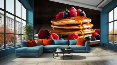  a delicious stack of pancakes topped with syrup and berries on a plate Wall mural