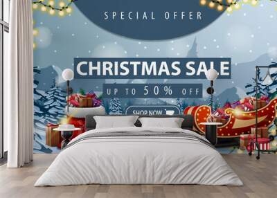 Special offer, Christmas sale, up to 50% off, beautiful discount banner with winter landscape on background, Santa Claus bag with presents and Santa Sleigh with presents Wall mural