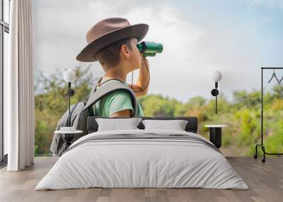 funny little tourist boy with binoculars Wall mural