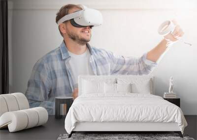 man wearing Virtual Reality VR Headset. VR for gaming. Man play game in VR glasses. Wall mural