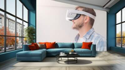 man wearing virtual reality vr headset. vr for gaming. man play game in vr glasses. Wall mural