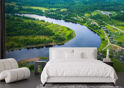 Bird's eye view of the green forests, river and the village. Karelia, Russia. Wall mural