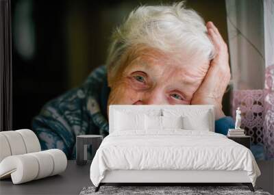 Gray-haired elderly woman portrait looking at the camera. Wall mural