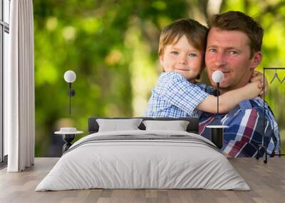 Portrait of father and son outdoors Wall mural