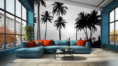 Silhouettes of palm trees on a tropical beach, black and white photography. Wall mural