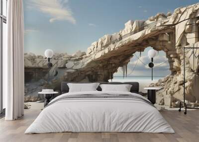 A weathered stone structure on a beach, showcasing decay and natural beauty. Wall mural