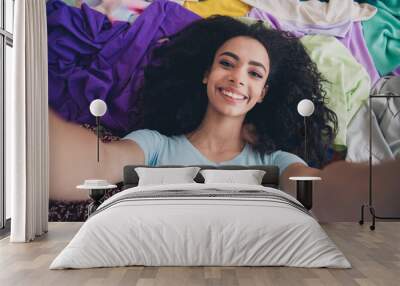 Above view photo of nice young girl take selfie toothy smile messy clutter clothes flat indoors Wall mural