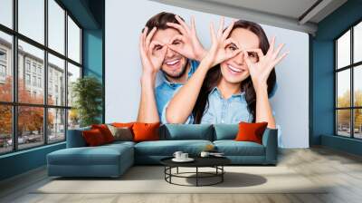 cheerful happy couple in love having fun and holding fingers nea Wall mural