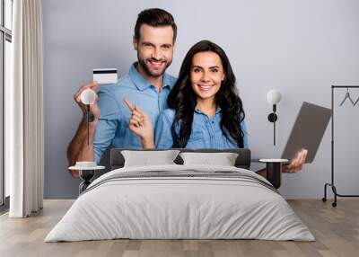 Close up photo beautiful amazing she her he him his couple lady guy hold credit card notebook show simple way internet buy pay  wear casual jeans denim shirts outfit clothes isolated grey background Wall mural