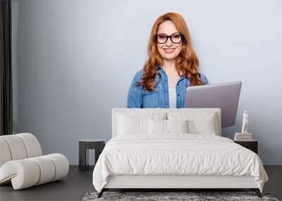 Close up photo beautiful she her curly foxy lady hold hands arms notebook read reader currency teacher smart clever intelligent wear specs casual blue jeans denim shirt isolated grey background Wall mural