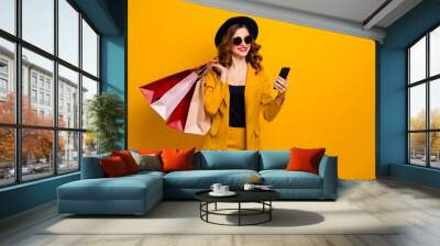 Close up photo beautiful she her lady hands arms telephone many packs buyer vacation traveler sale discount search gps next boutique wear specs formal-wear suit isolated yellow bright background Wall mural