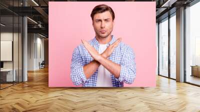 Close up photo of beautiful amazing pretty he him his handsome you will not enter here arms signal restricted territory wearing casual checkered plaid shirt outfit isolated on rose background Wall mural