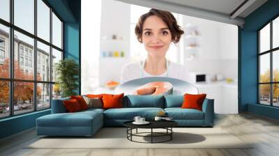 Close up photo of beautiful housewife lady enjoy tempting look of fresh raw salmon fillet steak showing tasty diet breakfast wear apron t-shirt stand modern kitchen indoors Wall mural