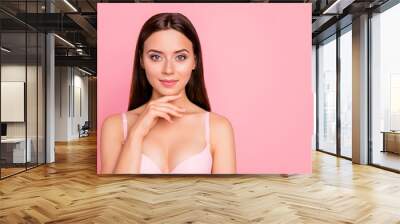 Close up portrait of attractive gorgeous tender brunette finger touching chin showing rejuvenation result her she woman wearing pale pink bra isolated on rose background Wall mural