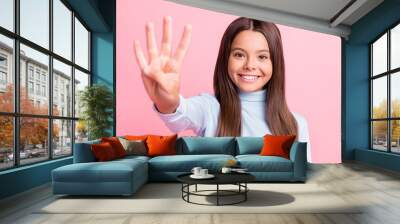 Close-up portrait of charming content cheerful brown-haired girl giving you four fingers isolated over pink pastel color background Wall mural