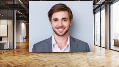 close up portrait of handsome successful man in formal wear on smoth blue background Wall mural