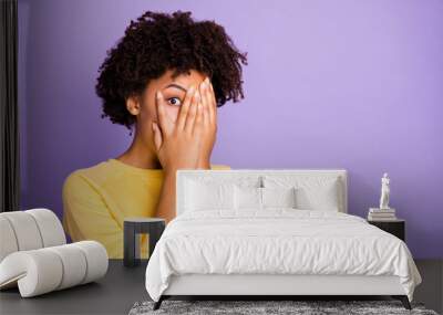 Close-up portrait of her she nice attractive charming lovely shy scared wavy-haired girl closing hiding face peeking isolated over violet purple lilac pastel color background Wall mural