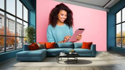 Close-up portrait of her she nice attractive lovely charming cute cheerful cheery wavy-haired girl using wi-fi smart gadget reading news isolated over pink pastel color background Wall mural