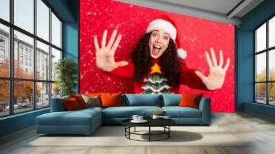 Close-up portrait of her she nice attractive lovely cute cheerful cheery wavy-haired Santa girl giving high five excellent advice isolated on bright vivid shine vibrant red color background Wall mural