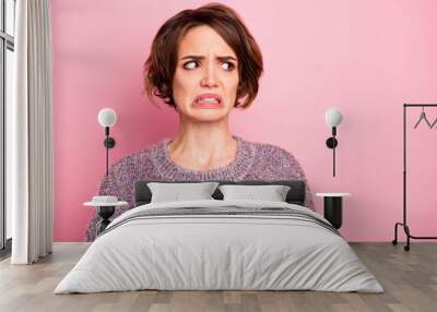 Close-up portrait of her she nice attractive lovely pretty brown-haired girl unpleasant look reaction grimacing isolated over pink pastel color background Wall mural