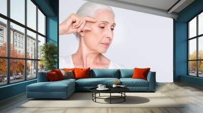 Close-up portrait of her she nice-looking attractive calm serious gray-haired lady showing temple place laser peeling elastic contour natural injection isolated on light white grey background Wall mural