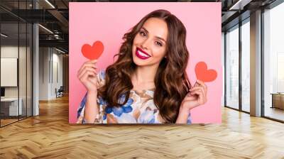 Close-up portrait of her she nice-looking attractive lovely lovable winsome cheerful cheery wavy-haired girl holding in hands two small little heart healthy life lifestyle isolated on pink background Wall mural