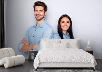 Close-up portrait of his he her she nice attractive cheerful cheery content couple partners leaders wearing casual folded arms standing back to back isolated over light white pastel color background Wall mural