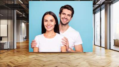 Close-up portrait of his he her she nice attractive lovely charming cute cheerful cheery couple soulmate hugging isolated on bright vivid shine vibrant blue green turquoise background Wall mural